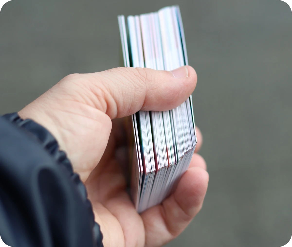 Hand holding a stack of cards